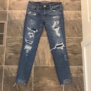 Medium wash distressed skinny super stretch  jeans